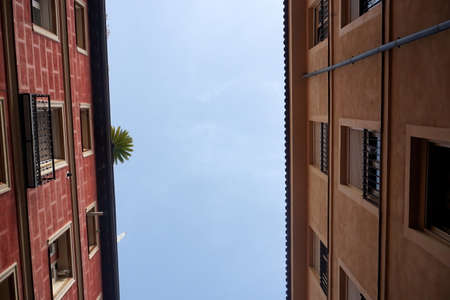Street view looking up at apartment block in city Madrid. Traditional architecture of Madrid, Spainの写真素材