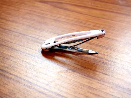 Girls old Hair clip lies on tableの写真素材