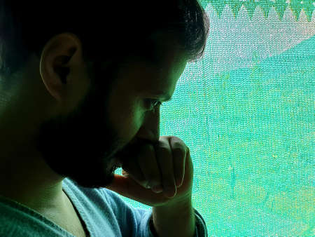A man is sad, helpless, depressed, in tension thinks on coronavirus.Corona or cover-19 stay home...