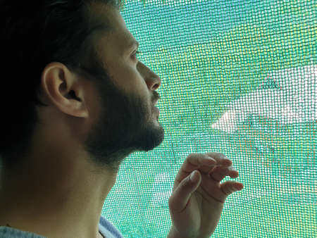 A man is sad, helpless, depressed, in tension thinks on coronavirus.Corona or cover-19 stay home...