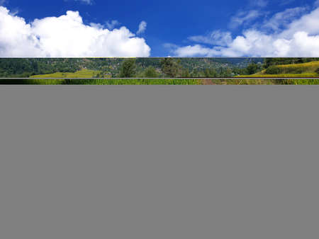 View of cloudy blue sky beautiful villages and rice fields of villagers in Indian states. Green and...