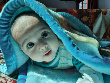 Beautiful kid different poses looks very handsome. Small child after born have soft cheeks and innocent small face with a shing smile.の写真素材