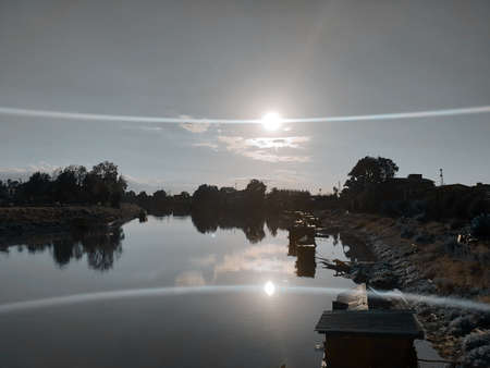 River water houseboats blue sky hills and water landscape and natural beauty in dal lake kashmir valley in india.の写真素材