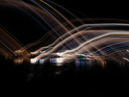 Blue, red, white and purple light painting photography, long exposure, ripples and waves against a...
