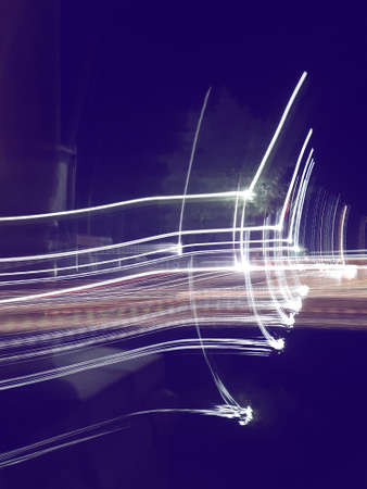 Blue, red, white and purple light painting photography, long exposure, ripples and waves against a...