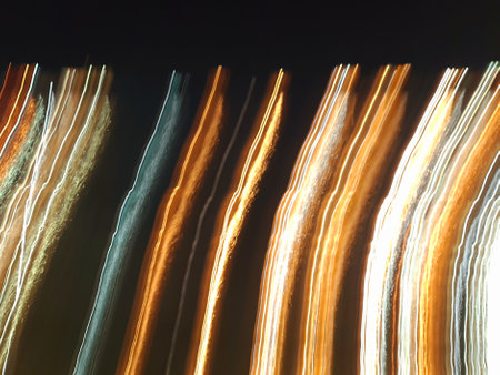 Blue, red, white and purple light painting photography, long exposure, ripples and waves against a...