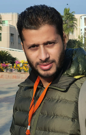 Model indian colour at a location in a pose. Photograph of a young smart asian man. Smiling a...