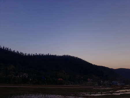 Kashmir beauty green hills forests in mountains. summer landscape with green grass on the hills....