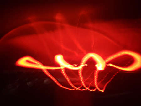 Light painting long exposure photography. Year 2022 out in multicolor red numbers against...