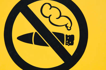 A yellow no smoking sign の写真素材