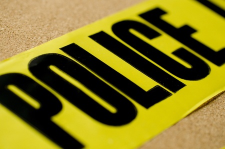 A close up of yellow crime scene tape.  The depth of field was shallow on purpose for effect. の写真素材