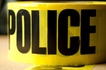 A close up of yellow crime scene tape.  The depth of field was shallow on purpose for effect. の写真素材