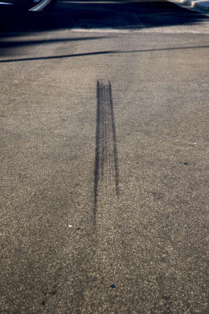 A view of skid marks on a local street of a car accident sceneの写真素材