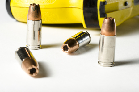 a close up of a police stun gun and bullets.