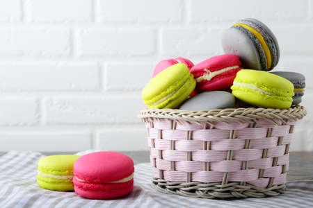 Macaroon in a wicker basket. Dessertの写真素材