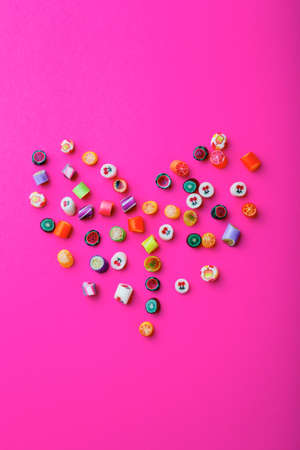 Multicolored candy canes on a pink background. Valentine dayの写真素材