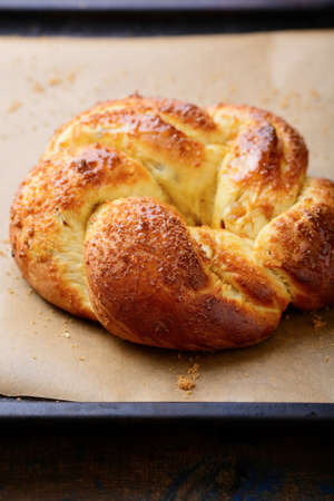 Golden bun on baking paper. Sweet pastryの写真素材
