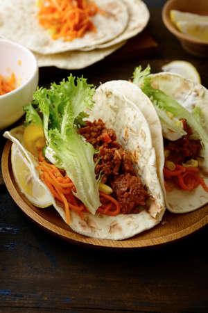 Two mexican Tacos with ground beef and vegetables. Closeupの写真素材