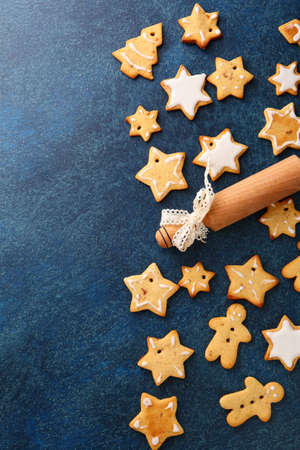 Christmas Gingerbread Cookies and rolling pin on a slate backgroundの写真素材