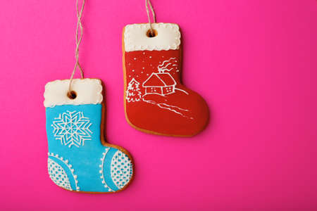 Pink holiday background with boos cookies, christmas symbolの写真素材
