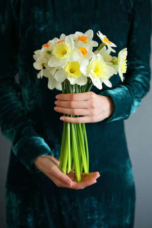 Bouquet daffodil in the hands of women. Sring flowersの写真素材