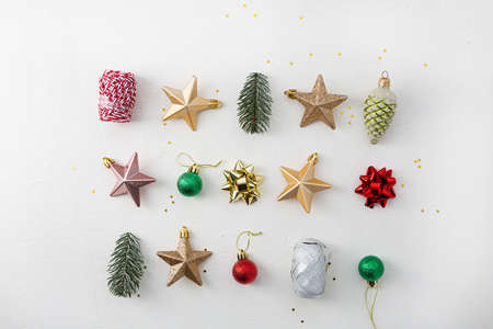 Overhead view of holiday present in hands. Christmas decorations red and green color