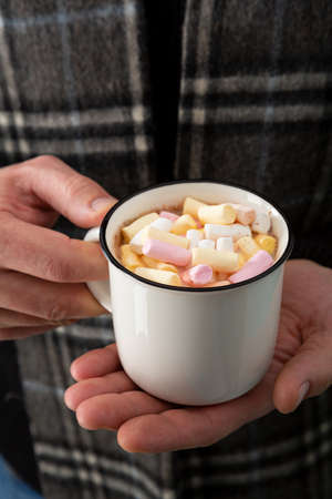 Overhead view of holiday present in hands. Christmas decorations red and green colorの写真素材