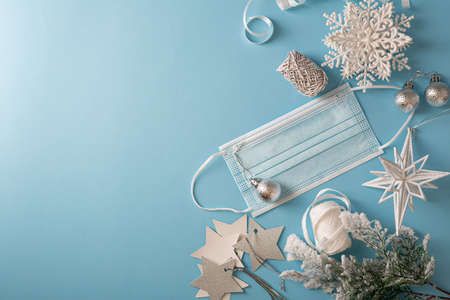 Christmas gift in hands on white surface, flat layの写真素材