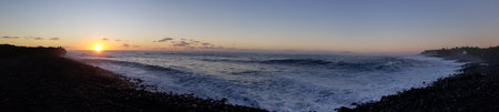 Panorama of a beautiful sunset over the Pacific Ocean in Tenerife