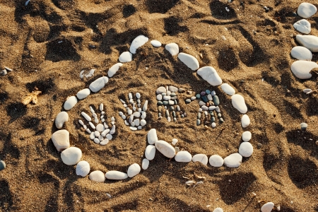 heart made with pebbles on the beach