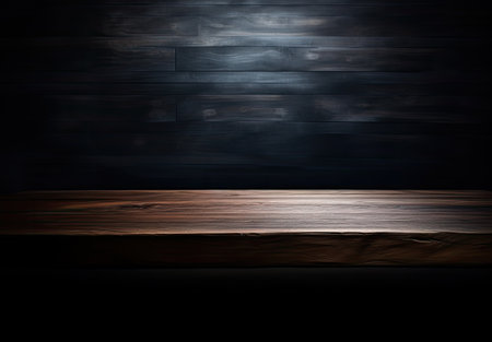 Wooden table in front of a dark background. For product displayの素材