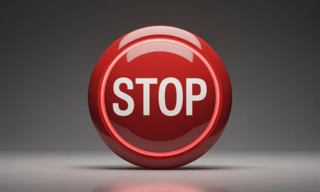 Bright red glossy circular stop button with white STOP text, symbolizing emergency, warning, danger, and critical control for immediate action.の素材