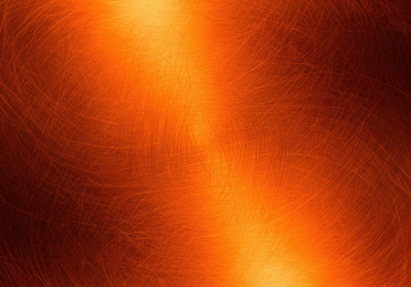 Abstract metallic background with a brushed copper texture, featuring fine, swirling scratch patterns and a warm, reflective orange and red glow.の素材