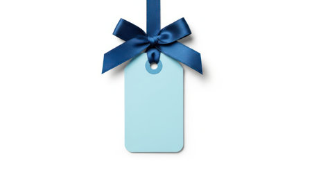 Blank light blue gift tag with a dark blue satin ribbon bow, isolated on a clean white background. perfect for messages, sales, or special occasion branding.の素材