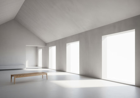 Spacious minimalist room with light grey plaster walls, a high vaulted ceiling, and large bright windows. a simple wooden slatted bench sits on the polished floor, illuminated by natural light.の素材
