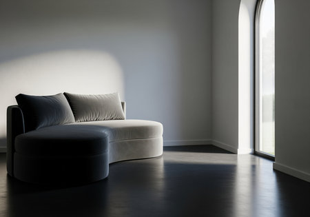 Elegant crescent shaped sofa with plush cushions in a bright, minimalist interior. soft natural light streams through an arched window, creating a serene and inviting atmosphere in the modern living space.の素材