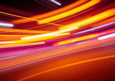 Abstract light trails with motion blur creating a dynamic burst of warm, saturated colors. energy, speed, and movement concept.の素材