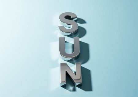 Polished chrome letters S, U, n arranged vertically on a light blue background, casting shadows. bright, clean, and minimalist composition. represents summer, warmth, and energy.の素材
