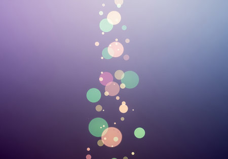 Abstract bokeh light circles in pastel colors float vertically on a smooth purple and blue gradient background. soft focus effect creates a dreamy and ethereal visual, suitable for decorative elements.の素材