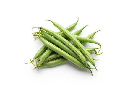Small cluster of raw, vibrant green bean pods, also known as string beans, neatly piled and isolated on a pure white background. healthy vegetable ingredient for cooking and nutrition.の素材