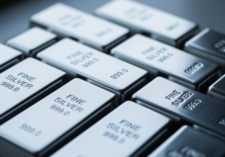 Highly polished fine silver bullion bars stacked closely together, marked with 999.0 purity. ideal for concepts related to finance, wealth, and commodity investment.の素材