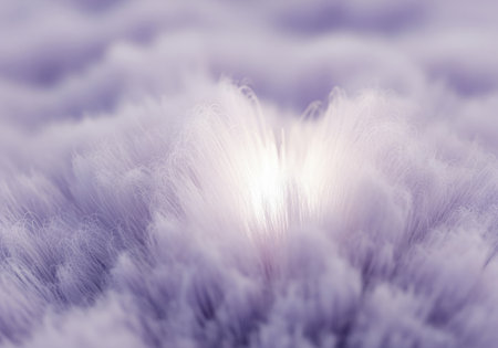 Fluffy purple abstract material seen in extreme closeup, resembling soft fur or clouds. a brilliant white light radiates from the center, providing a dreamy, ethereal, and gentle background texture.の素材