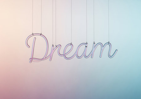 Elegant script word dream made of iridescent glass tubing suspended by thin wires. soft gradient background suggests aspiration, imagination, and hope.の素材