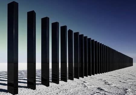 Long row of glossy black rectangular columns standing on a white, textured surface under a blue sky, creating a conceptual boundary and strong perspective effect.の素材
