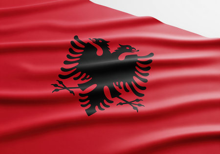National flag of albania, featuring the iconic black double headed eagle centered on a vibrant red field. realistic fabric texture and folds visible. symbol of patriotism and national identity.の素材