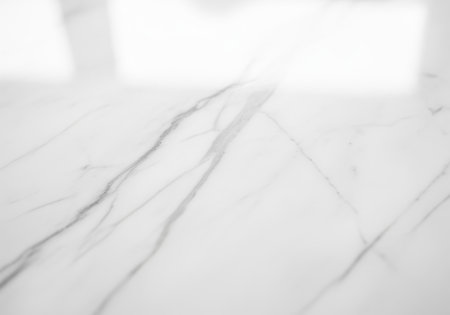 Elegant white polished marble stone surface texture featuring delicate natural gray veining. luxurious background for product display, interior design, architecture, and abstract conceptsの素材