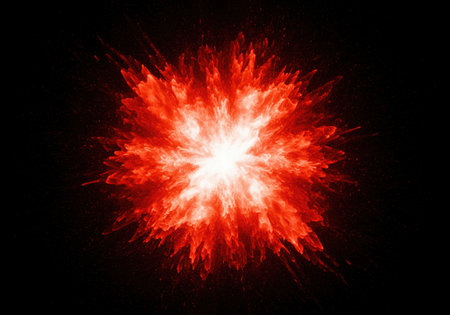 Intense fiery red and orange abstract energy burst radiating outward from a bright white center against a deep black background. dynamic explosion effect.の素材