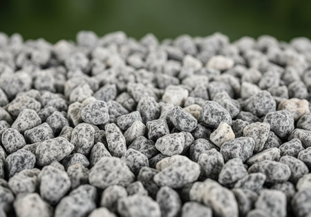 Clean decorative gray speckled granite gravel texture filling the frame, suitable for landscaping, construction, and abstract background use.の素材