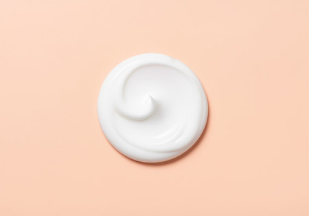A close up view of a thick, luxurious white cream dollop showing its smooth, rich texture. ideal for advertising skincare, body lotion, or cosmetic products.の素材