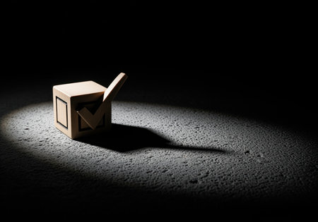 Wooden checkmark block resting on a rough, dark surface, intensely illuminated by a spotlight. symbolizes choice, voting, confirmation, success, and decision making.の素材